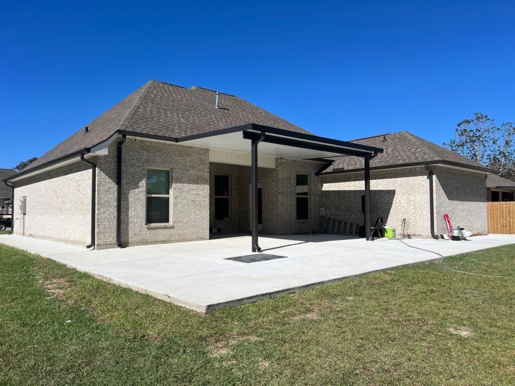 New concrete slab with an aluminum patio cover