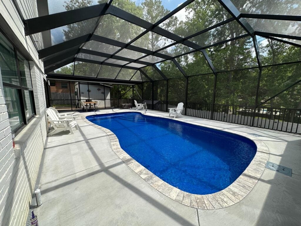 Screened pool enclosure with a freeform pool