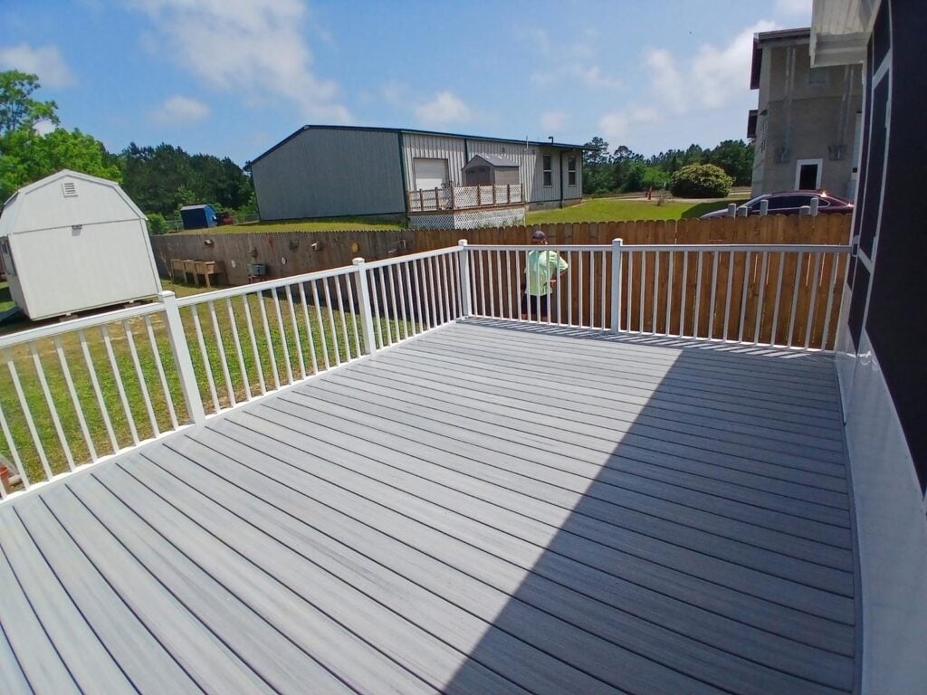 Custom white aluminum railing on a raised deck